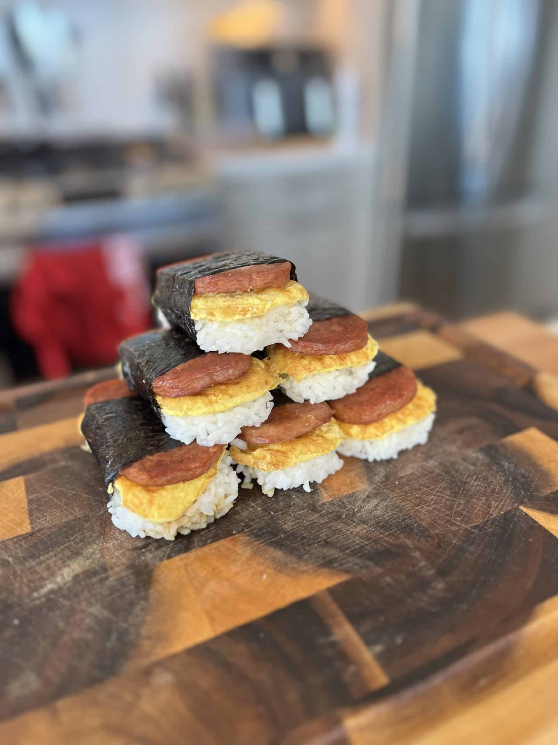 five spam musubi with egg rice and nori