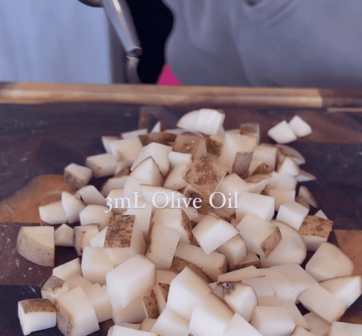 chopped potatoes on cutting board